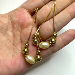 Gold dangle faux pearl earrings